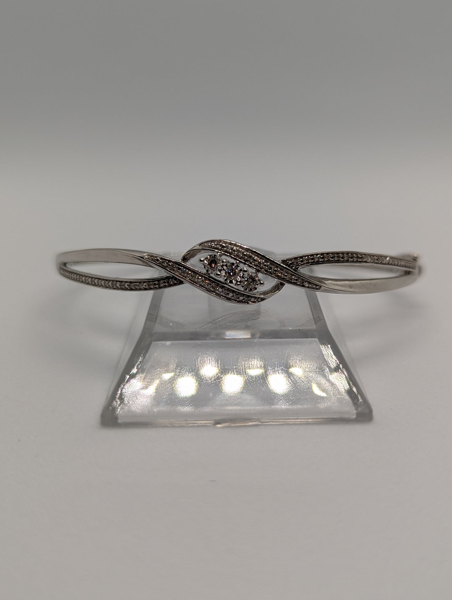 Sterling Silver 1/4CT. Diamond 3-Stone Bypass Hinged Bangle Bracelet